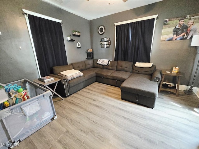 815 Denman Ave, Coshocton, OH 43812 - living room featuring wood finished floors and ceiling fan