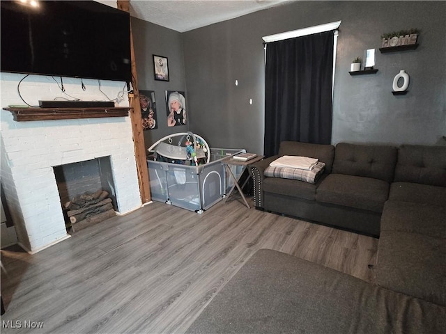 815 Denman Ave, Coshocton, OH 43812 - living room with wood finished floors and a fireplace
