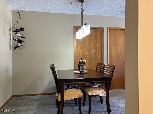 19510 Lorain Rd, Fairview Park, OH 44126 - dining room with carpet flooring, a textured ceiling, and baseboards