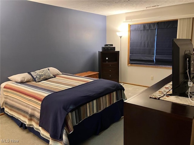 19510 Lorain Rd, Fairview Park, OH 44126 - carpeted bedroom with a textured ceiling and baseboards
