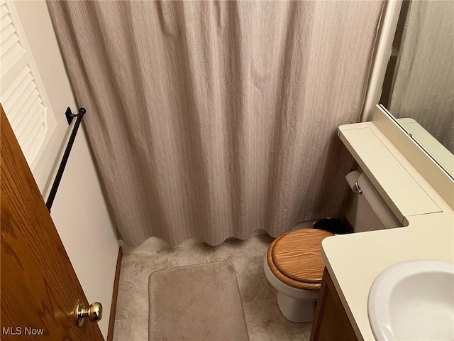 19510 Lorain Rd, Fairview Park, OH 44126 - bathroom featuring toilet, vanity, tile patterned flooring, and a shower with shower curtain