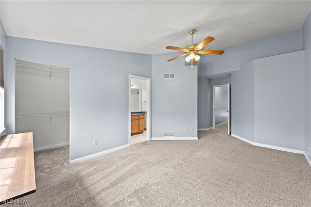 6465 Saint Andrews Dr Unit 6, Canfield, OH 44406 - unfurnished bedroom with carpet floors, a closet, baseboards, connected bathroom, and a walk in closet