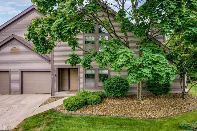 6465 Saint Andrews Dr Unit 6, Canfield, OH 44406 - view of front of house with concrete driveway and a garage