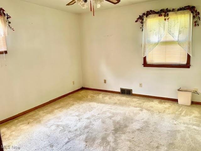 1148 Miami Ave, Youngstown, OH 44505 - spare room with a ceiling fan, carpet flooring, and baseboards
