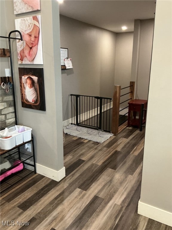 7030 Jones Rd, Nashport, OH 43830 - hallway with an upstairs landing, wood finished floors, baseboards, and recessed lighting