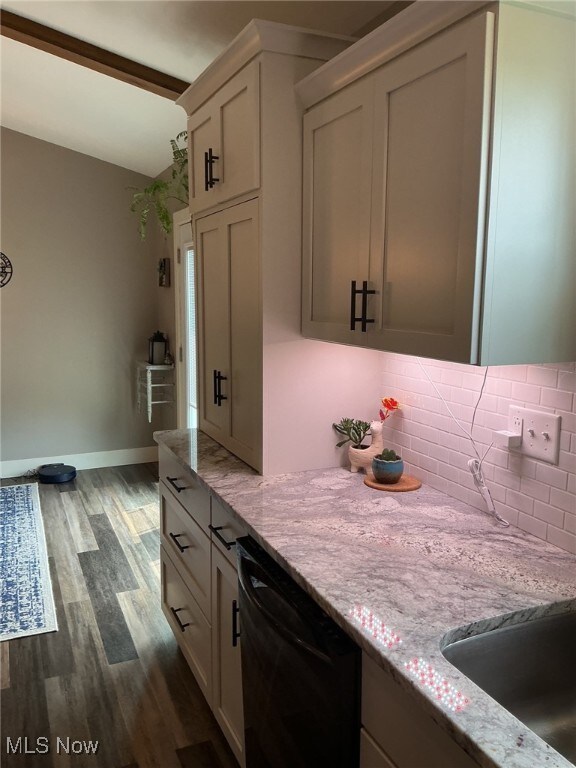 7030 Jones Rd, Nashport, OH 43830 - kitchen featuring dishwasher, dark wood finished floors, decorative backsplash, and light stone counters