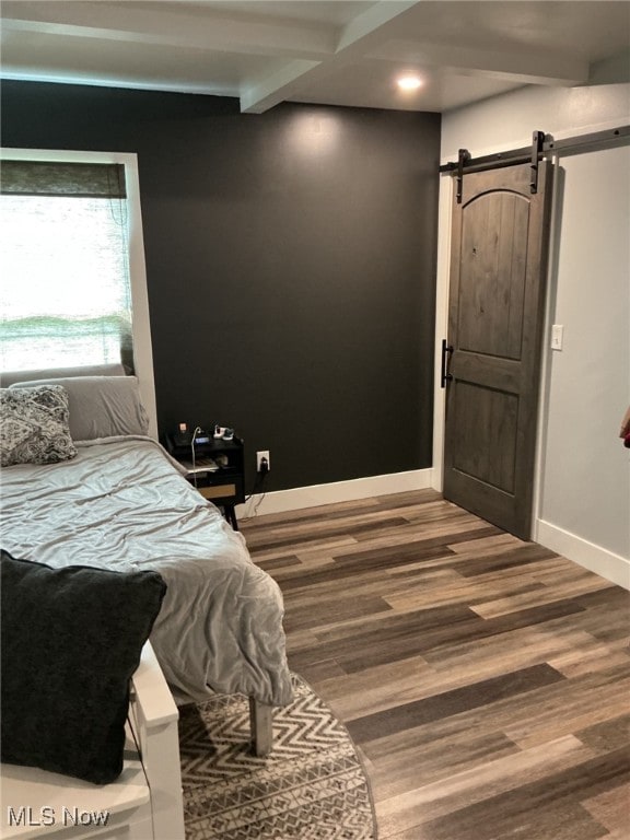 7030 Jones Rd, Nashport, OH 43830 - bedroom with wood finished floors, a barn door, baseboards, beam ceiling, and recessed lighting