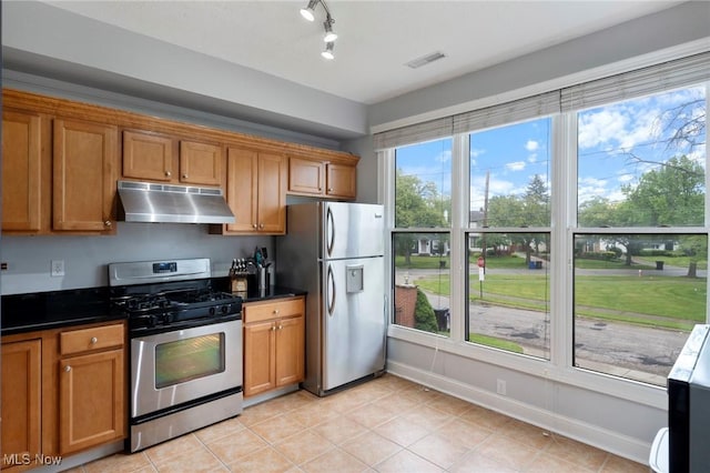 3128 E 135th St Unit 4, Cleveland, OH 44120 - kitchen with range hood, appliances with stainless steel finishes, brown cabinets, and dark countertops