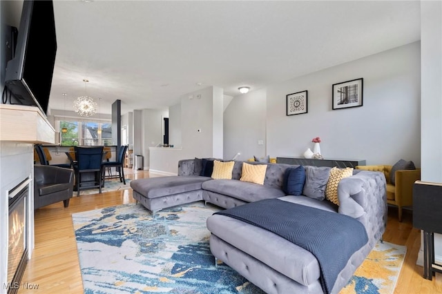 3128 E 135th St Unit 4, Cleveland, OH 44120 - living room featuring light wood finished floors and a chandelier