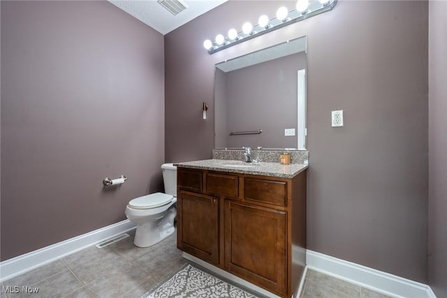3128 E 135th St Unit 4, Cleveland, OH 44120 - bathroom featuring vanity, toilet, baseboards, and tile patterned floors