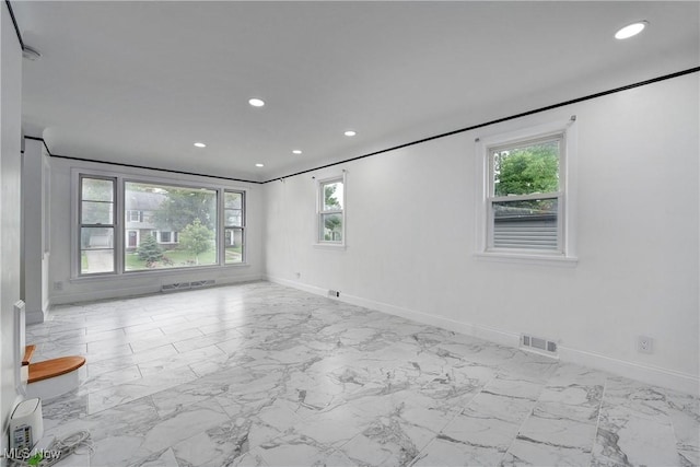 2330 Traymore Rd, University Heights, OH 44118 - spare room with baseboards, plenty of natural light, recessed lighting, and marble look tile flooring