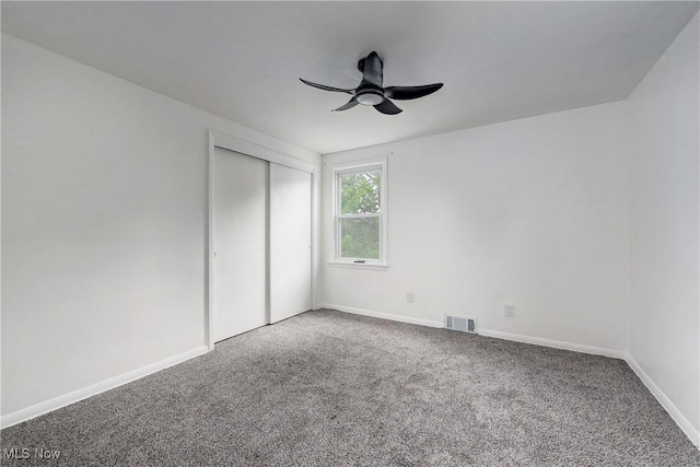2330 Traymore Rd, University Heights, OH 44118 - unfurnished bedroom featuring carpet flooring, a closet, baseboards, and ceiling fan