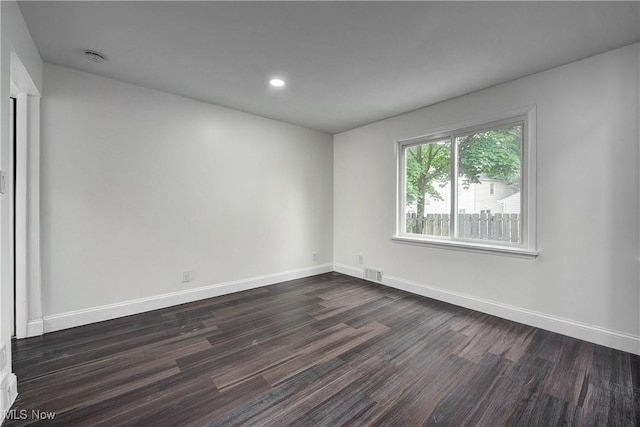 2330 Traymore Rd, University Heights, OH 44118 - unfurnished room with dark wood-style flooring, baseboards, and recessed lighting