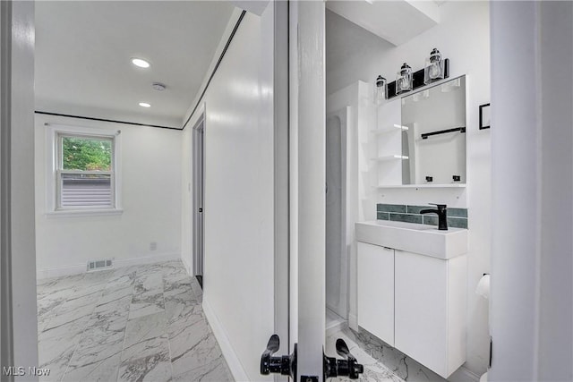 2330 Traymore Rd, University Heights, OH 44118 - bathroom featuring marble finish floors, vanity, baseboards, and recessed lighting