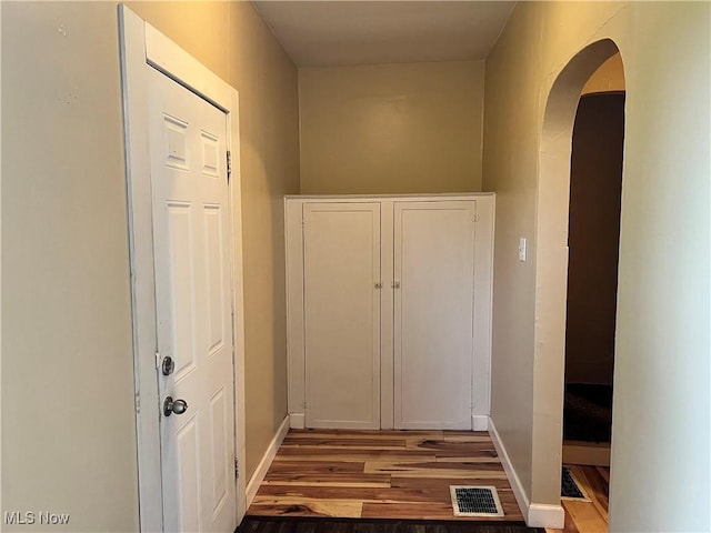 1705 Etruria St, East Liverpool, OH 43920 - hallway with wood finished floors, arched walkways, and baseboards