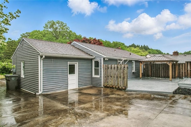 2506 Bears Den Rd, Youngstown, OH 44511 - rear view of house featuring a gazebo, a patio area, roof with shingles, and a wooden deck