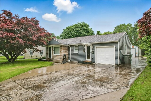 2506 Bears Den Rd, Youngstown, OH 44511 - single story home with a garage, a front yard, roof with shingles, and driveway