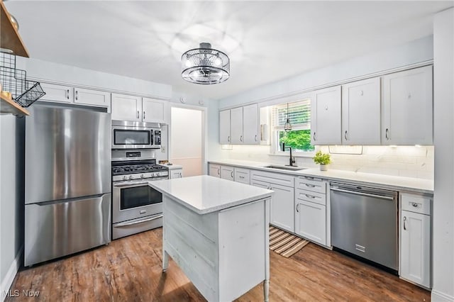 2506 Bears Den Rd, Youngstown, OH 44511 - kitchen with stainless steel appliances, a sink, light countertops, and backsplash