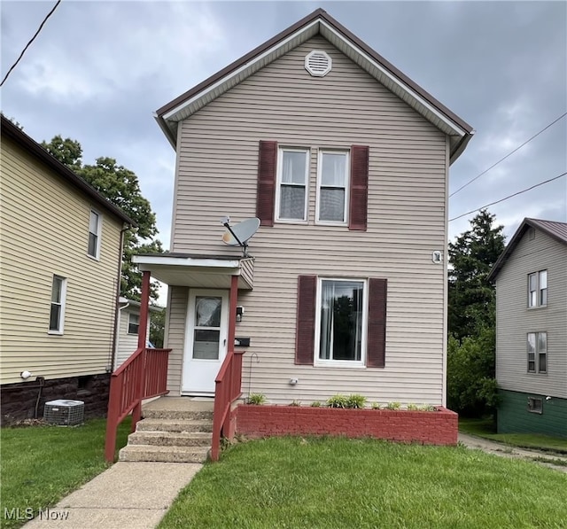 613 E Main St, Barnesville, OH 43713 - traditional-style house with a front yard and central AC unit
