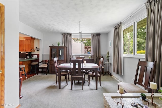 4937 Stevens Rd, Akron, OH 44319 - dining space with light colored carpet and a textured ceiling