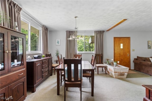 4937 Stevens Rd, Akron, OH 44319 - dining area with plenty of natural light, light colored carpet, and a textured ceiling