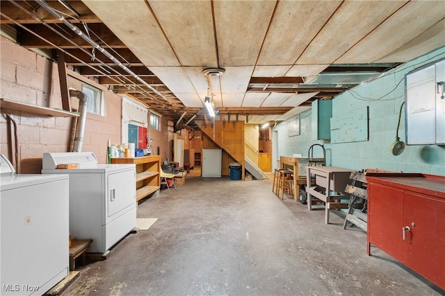 4937 Stevens Rd, Akron, OH 44319 - basement featuring washing machine and dryer and a workshop area
