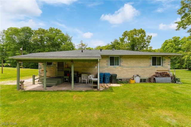 4937 Stevens Rd, Akron, OH 44319 - back of property with a patio area and a yard