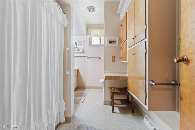 4937 Stevens Rd, Akron, OH 44319 - bathroom with a baseboard heating unit, tile patterned flooring, toilet, vanity, and curtained shower