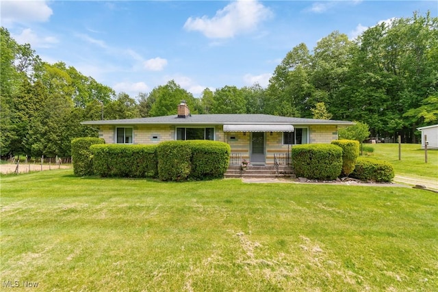 4937 Stevens Rd, Akron, OH 44319 - view of front of home with a front yard and a chimney