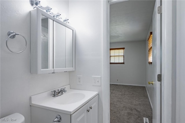 4822 7th Ave, Vienna, WV 26105 - bathroom with vanity, toilet, and baseboards