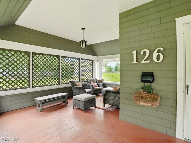 126 W Jefferson St, Jefferson, OH 44047 - living area featuring vaulted ceiling and wood finished floors
