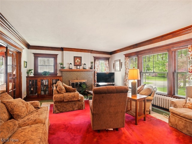 126 W Jefferson St, Jefferson, OH 44047 - carpeted living area featuring radiator, crown molding, and a fireplace