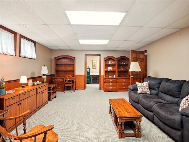 126 W Jefferson St, Jefferson, OH 44047 - living area with light carpet, wainscoting, a drop ceiling, and wooden walls