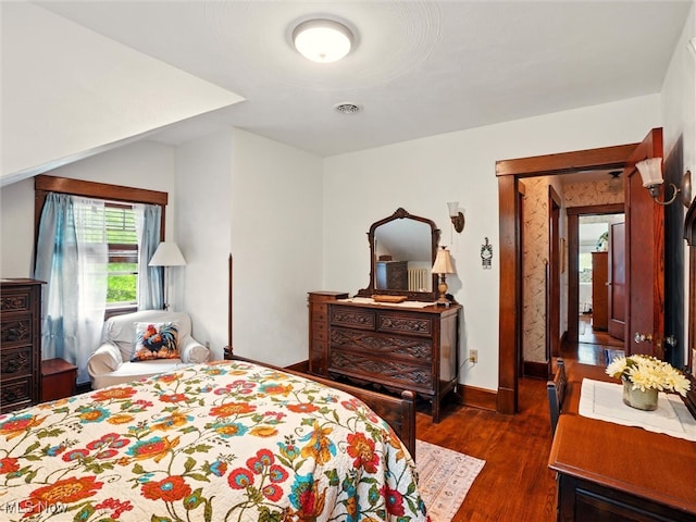 126 W Jefferson St, Jefferson, OH 44047 - bedroom featuring dark wood-style flooring and baseboards