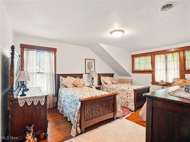 126 W Jefferson St, Jefferson, OH 44047 - bedroom with wood finished floors and radiator heating unit