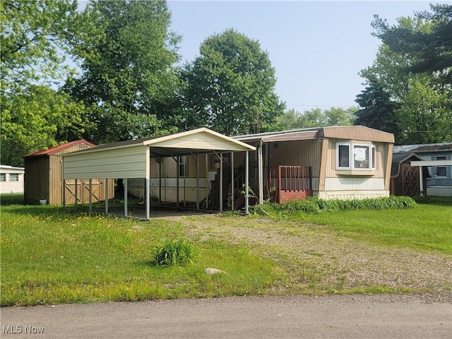 71 Rustic Ln, Apple Creek, OH 44606 - view of front of house with a carport and a front lawn