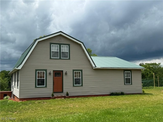 71322 Sharon Rd, Bridgeport, OH 43912 - view of front facade with a front yard, metal roof, and a gambrel roof