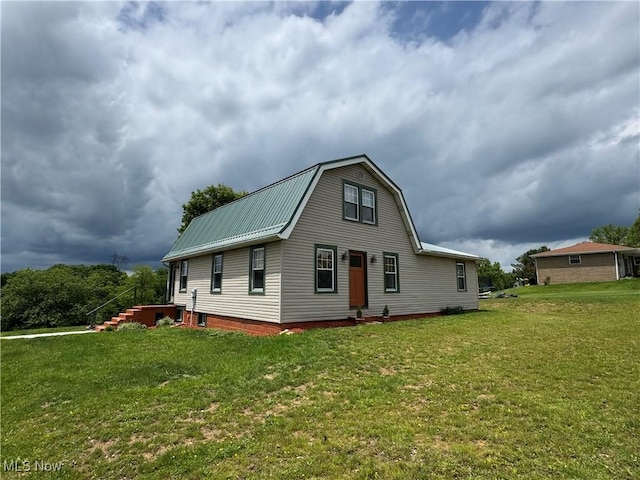71322 Sharon Rd, Bridgeport, OH 43912 - back of house with a yard, metal roof, and a gambrel roof
