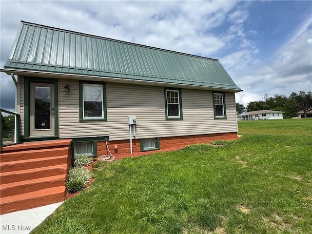 71322 Sharon Rd, Bridgeport, OH 43912 - back of property featuring a lawn and metal roof