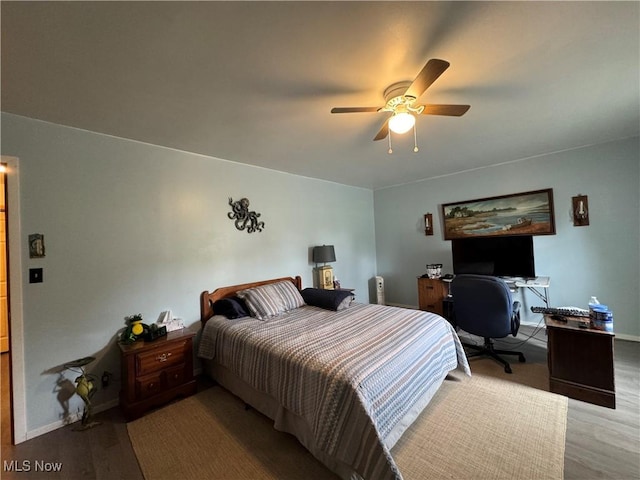 71322 Sharon Rd, Bridgeport, OH 43912 - bedroom featuring wood finished floors, baseboards, and a ceiling fan