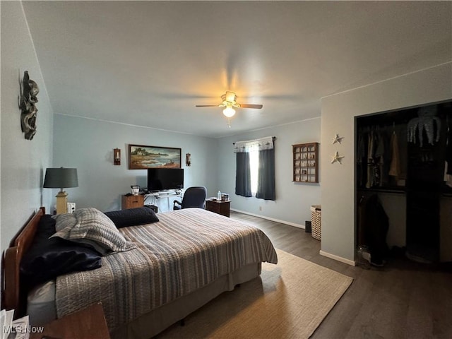 71322 Sharon Rd, Bridgeport, OH 43912 - bedroom with wood finished floors, a ceiling fan, baseboards, a closet, and a desk