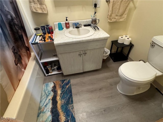 71322 Sharon Rd, Bridgeport, OH 43912 - bathroom with toilet, wood finished floors, vanity, and baseboards