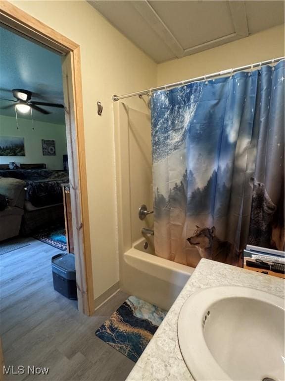 71322 Sharon Rd, Bridgeport, OH 43912 - bathroom with wood finished floors, shower / bath combo, vanity, and ceiling fan