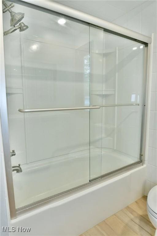 8848 King Graves Rd NE, Warren, OH 44484 - bathroom featuring shower / bath combination with glass door, toilet, and wood finished floors
