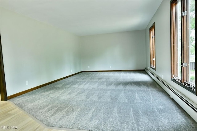 8848 King Graves Rd NE, Warren, OH 44484 - carpeted spare room with a baseboard radiator and baseboards