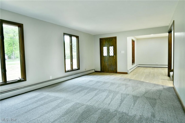 8848 King Graves Rd NE, Warren, OH 44484 - carpeted empty room with a baseboard heating unit and baseboards