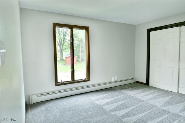 8848 King Graves Rd NE, Warren, OH 44484 - unfurnished bedroom featuring carpet floors and a baseboard radiator