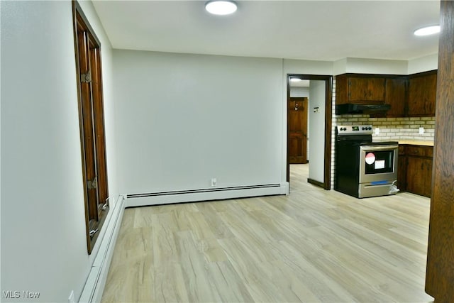 8848 King Graves Rd NE, Warren, OH 44484 - kitchen with stainless steel range with electric stovetop, under cabinet range hood, a baseboard radiator, backsplash, and light wood-type flooring