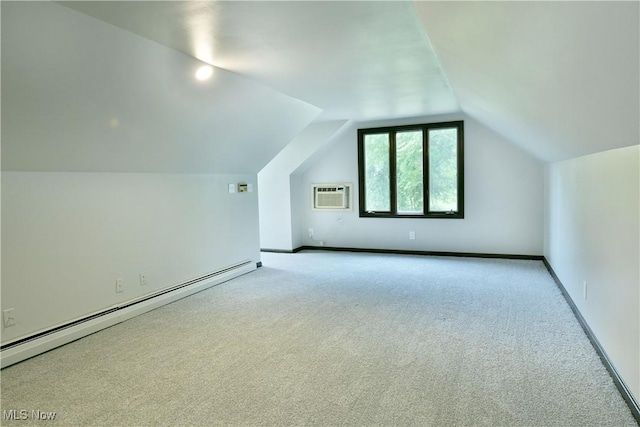 8848 King Graves Rd NE, Warren, OH 44484 - bonus room with baseboard heating, a wall mounted air conditioner, carpet flooring, and lofted ceiling
