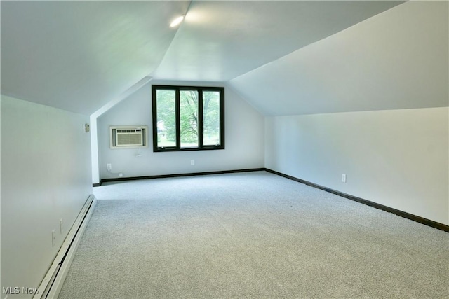 8848 King Graves Rd NE, Warren, OH 44484 - additional living space with a baseboard heating unit, a wall mounted AC, carpet, vaulted ceiling, and baseboards
